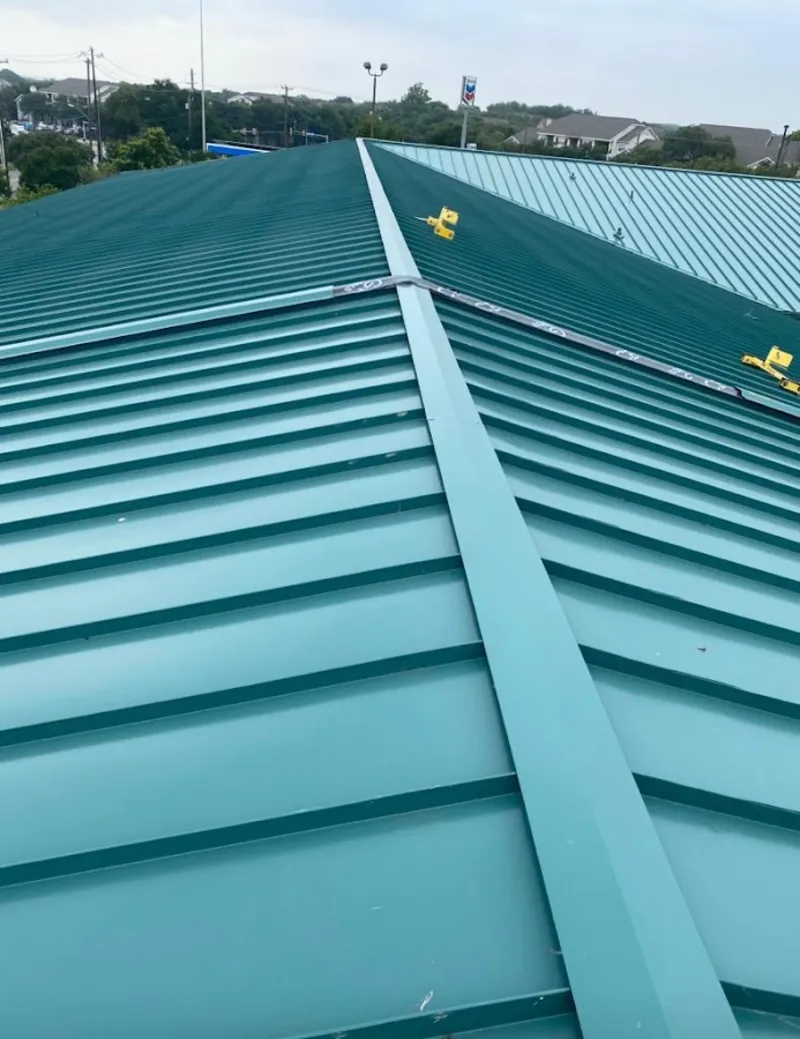 Green commercial metal roof ridge and valley for Metal Roof Repair in Platteville